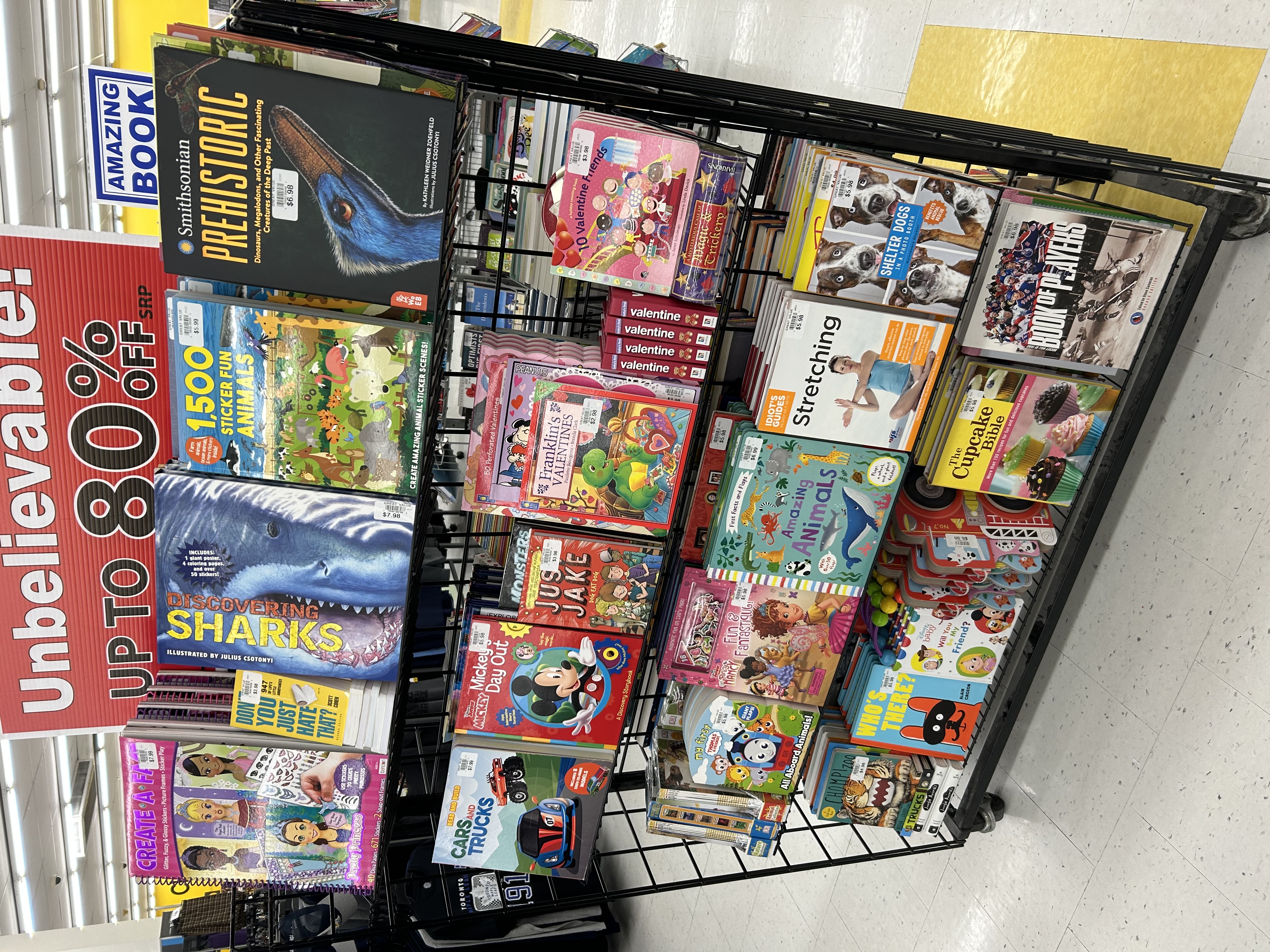 A Promotional Book Company display rack in a Canadian retail store